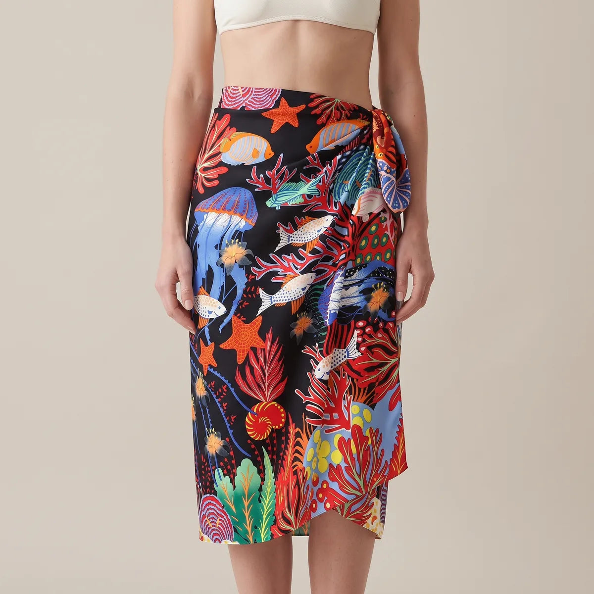 Jellyfish print silk shawl wrapped around the hips as a sarong, coral and fish running down the skirt