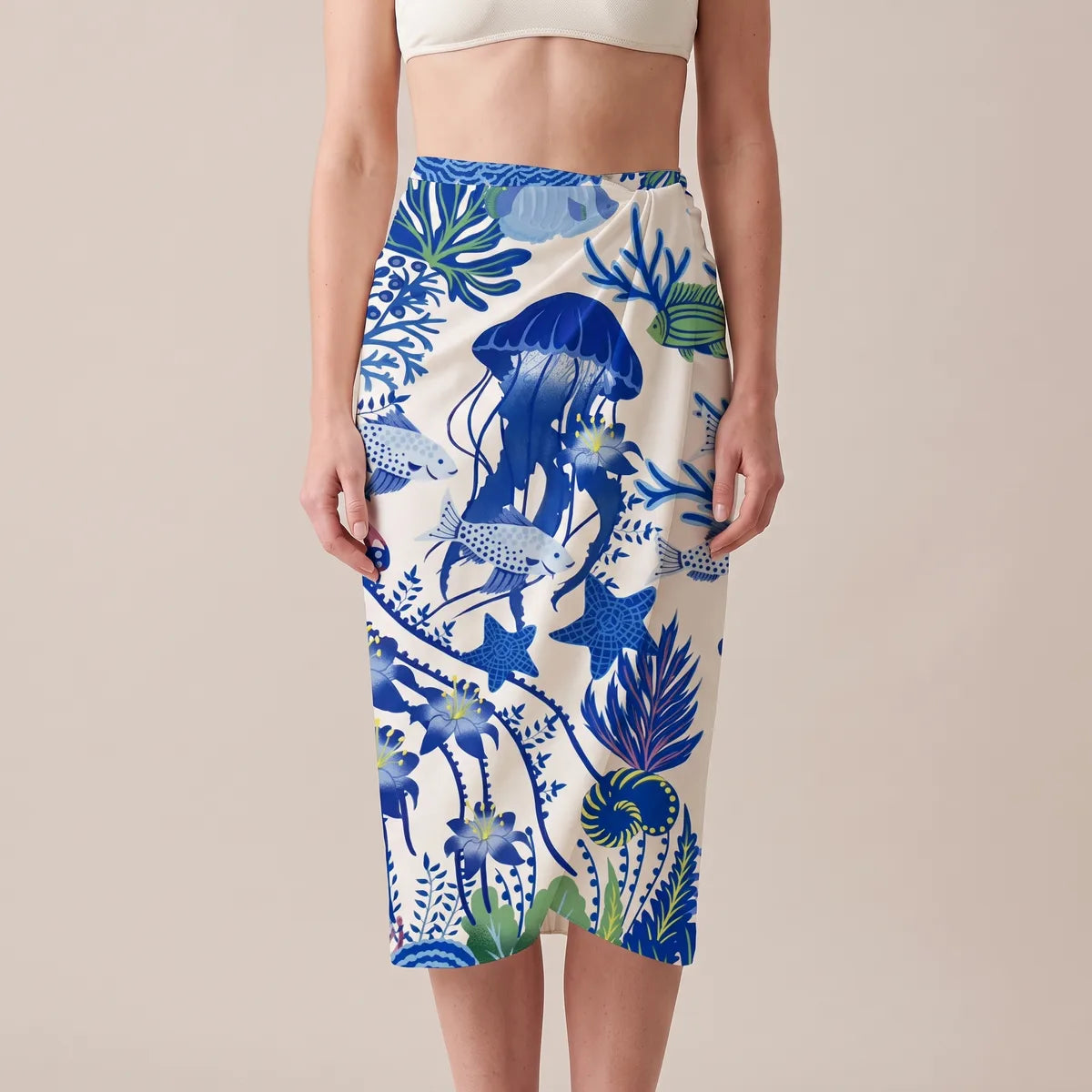 Blue sea life silk shawl wrapped around the hips as a sarong, a cobalt jellyfish across the front