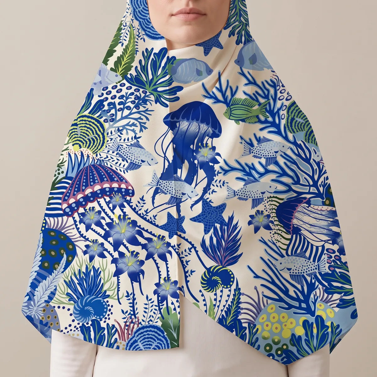 Cobalt and cream jellyfish shawl drawn up over the hair, the big blue jellyfish centered on the chest