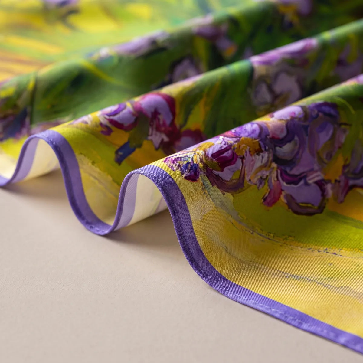 Soft waves of the iris bandana showing its violet band and a paler reverse curling at the hem