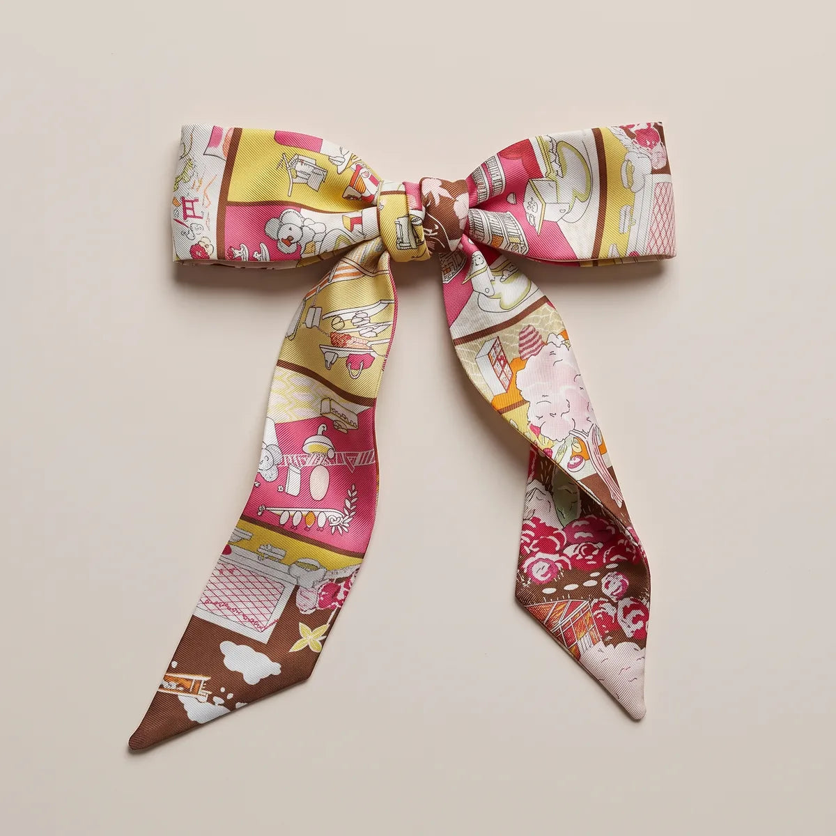 Hot pink skinny silk scarf tied in a bow, a kitchen panel on one loop and the blossom tree below