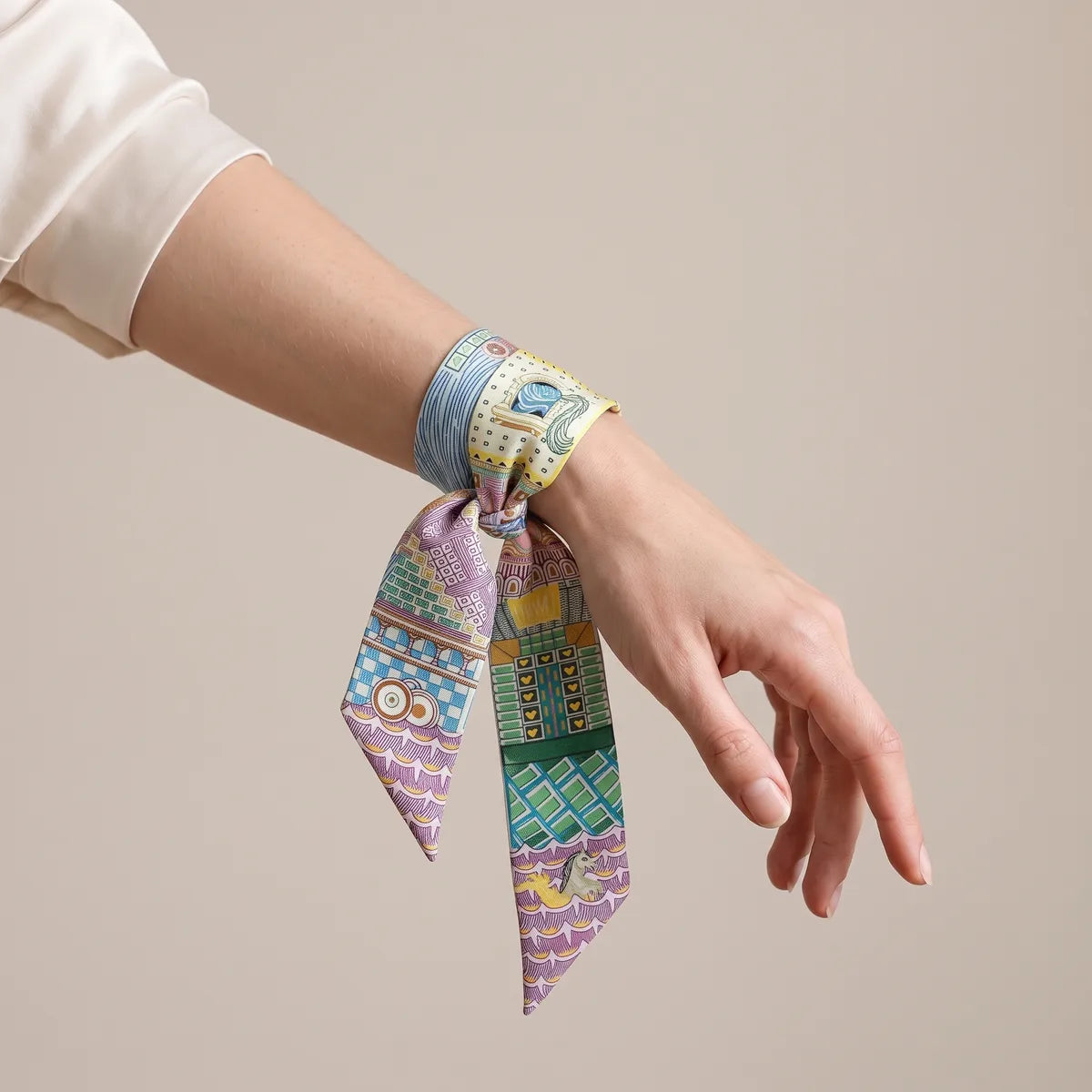 Lilac and blue skinny silk and satin scarf wrapped around the wrist and knotted