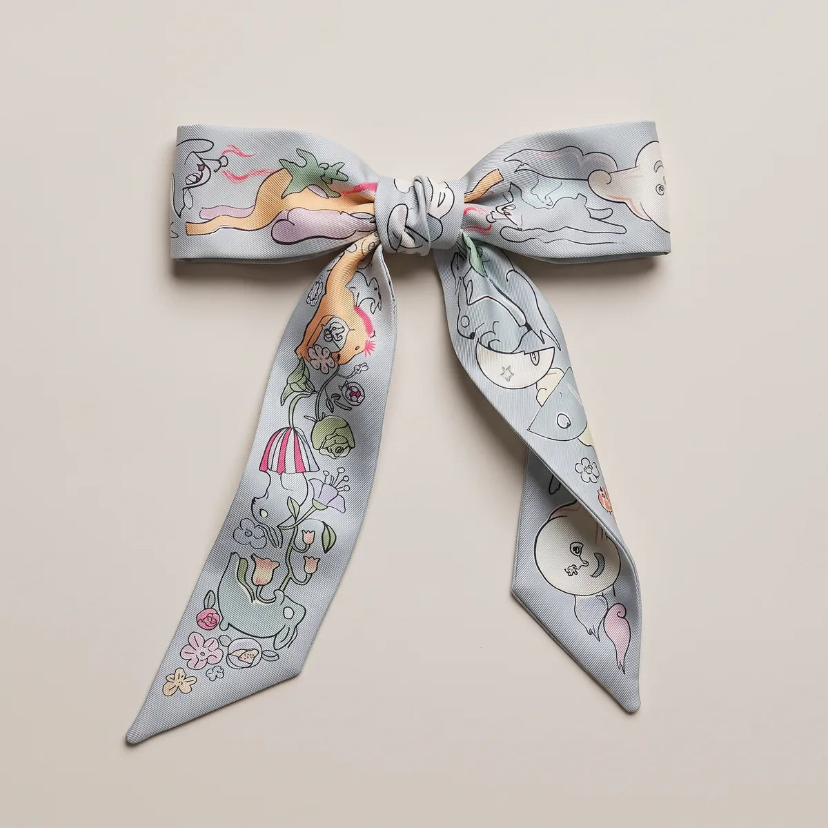 Pale blue skinny silk scarf tied in a bow, an apricot horse leaping across the left loop