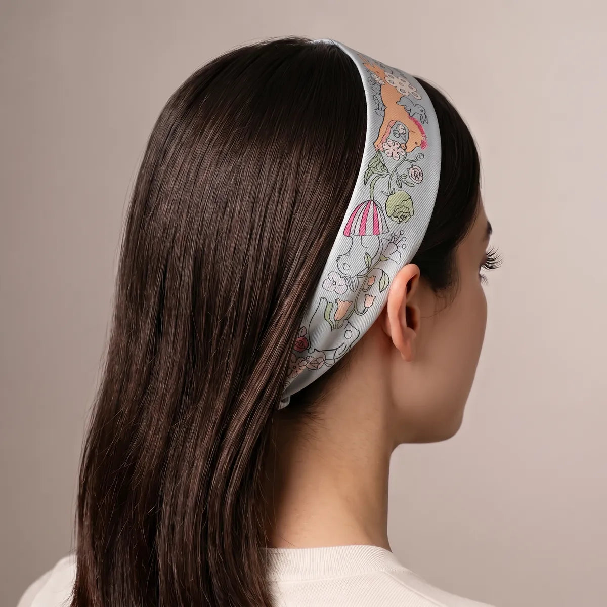 Light blue skinny scarf as a headband over straight dark hair, apricot horse visible on top