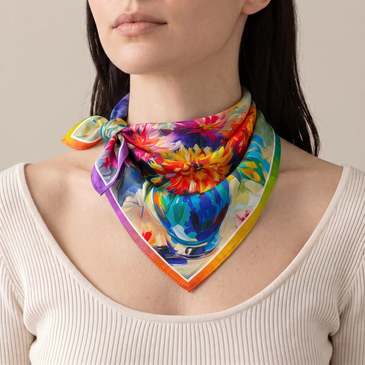 Woman wearing a multicolor floral silk scarf knotted at the side of the neck, the blue vase at the front