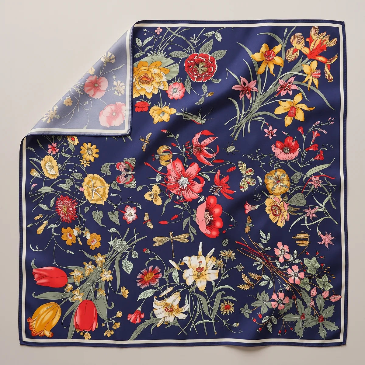 Navy botanical floral silk shawl laid flat: red tulips, yellow lilies and wild flowers on navy, cream border
