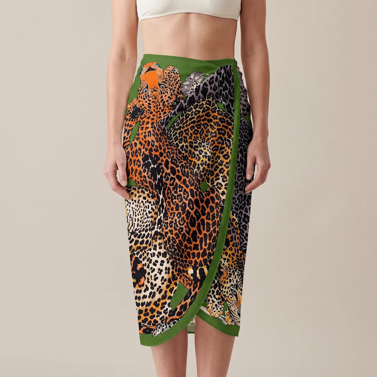Orange and gray leopard silk shawl wrapped at the waist as a sarong, the green border running down the front overlap