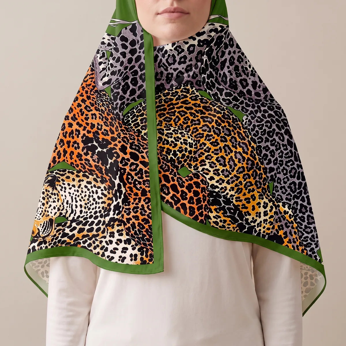 Orange and gray leopard shawl draped over the head, green edge framing the face, open over a white top