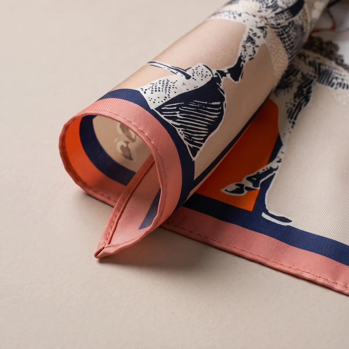 Pink-edged corner curled over, showing a navy stripe and part of the sketched horse in navy lines