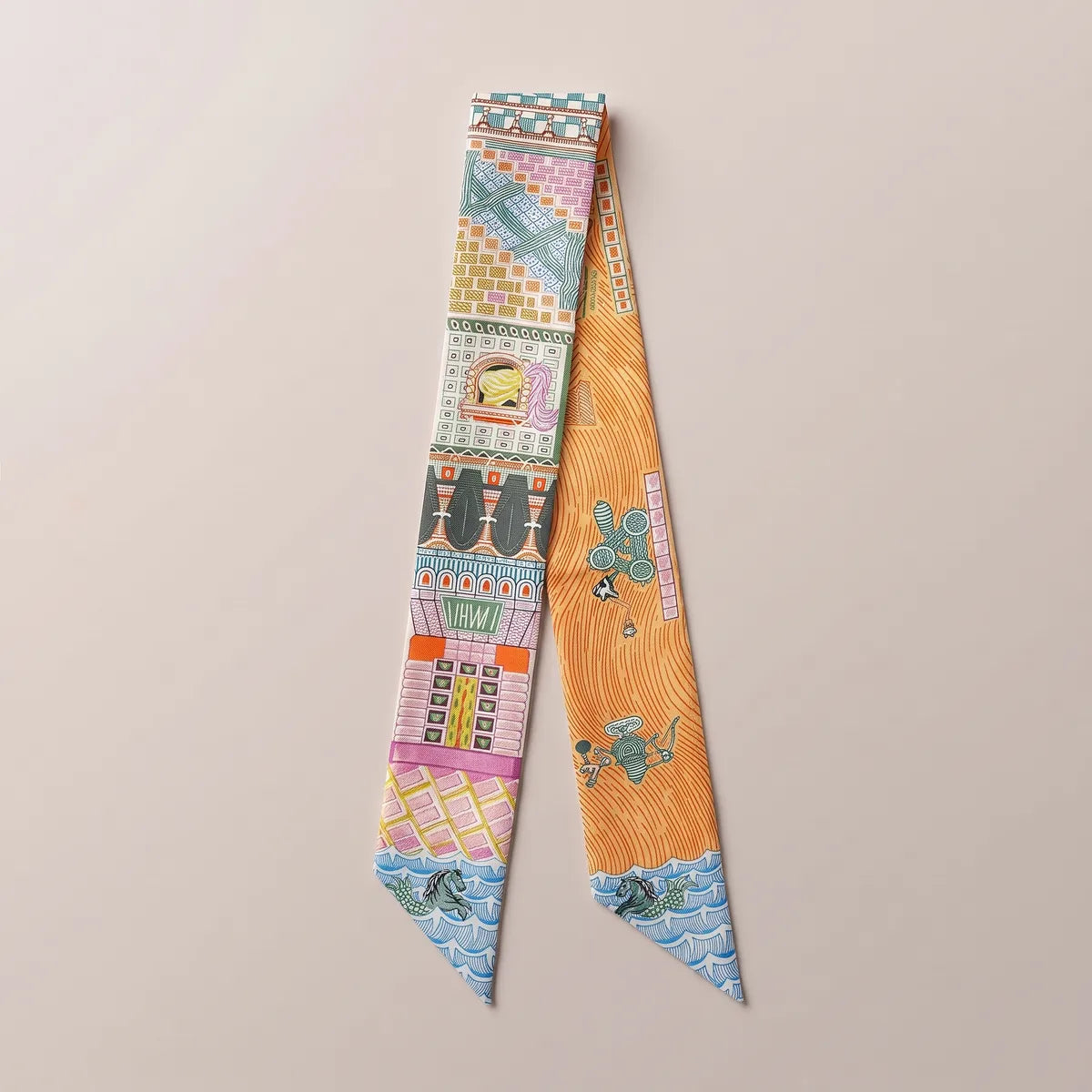 Orange architecture skinny silk and satin scarf laid flat: pink facades on one strand, orange wavy lines on the other