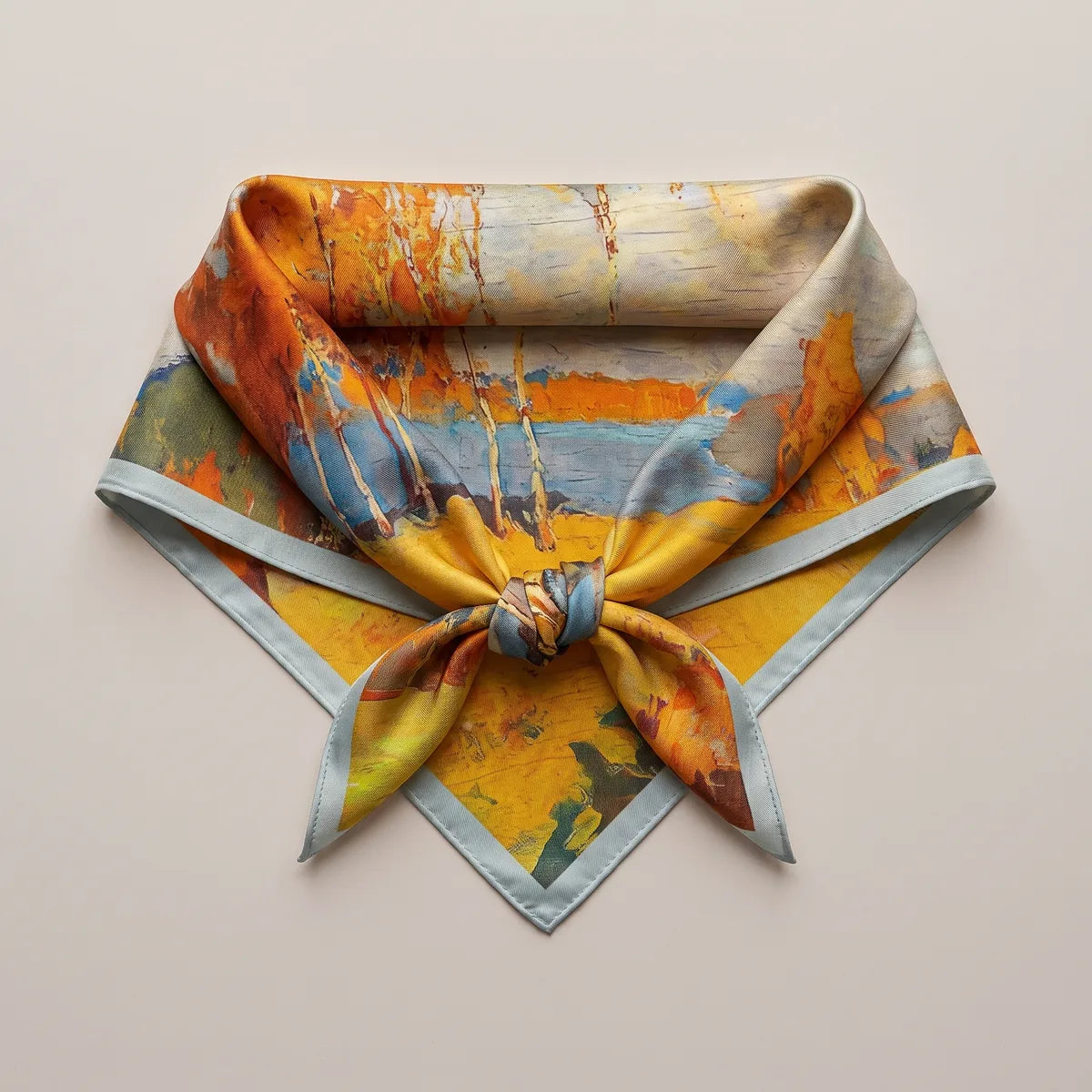 Autumn landscape silk square knotted and laid flat, yellow field below the knot and orange trees above