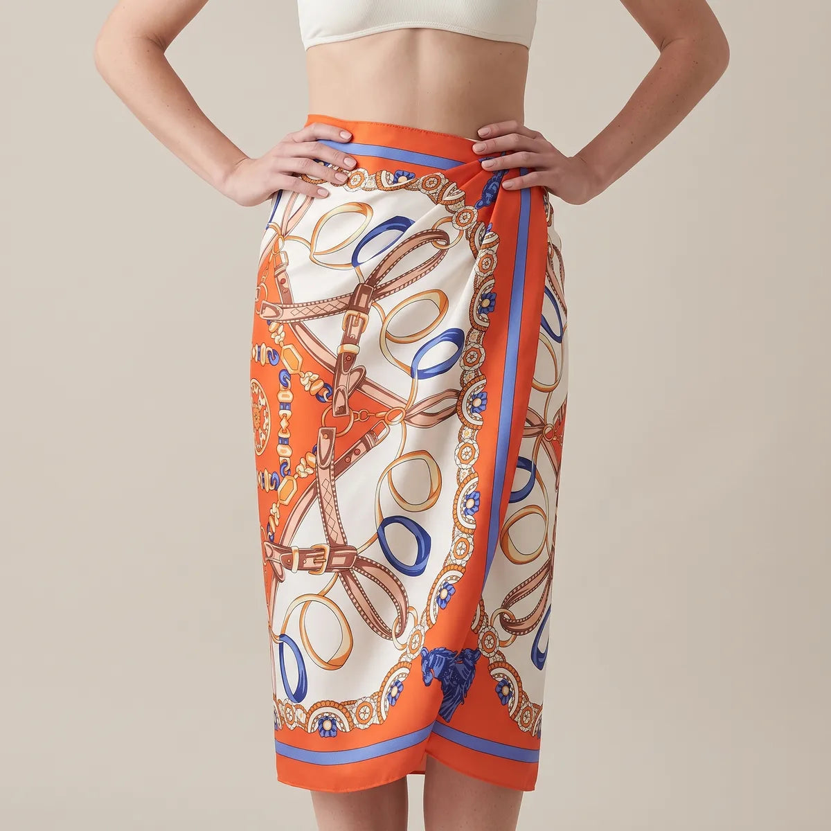 Orange print silk shawl wrapped at the waist as a sarong skirt, the overlap running down the front