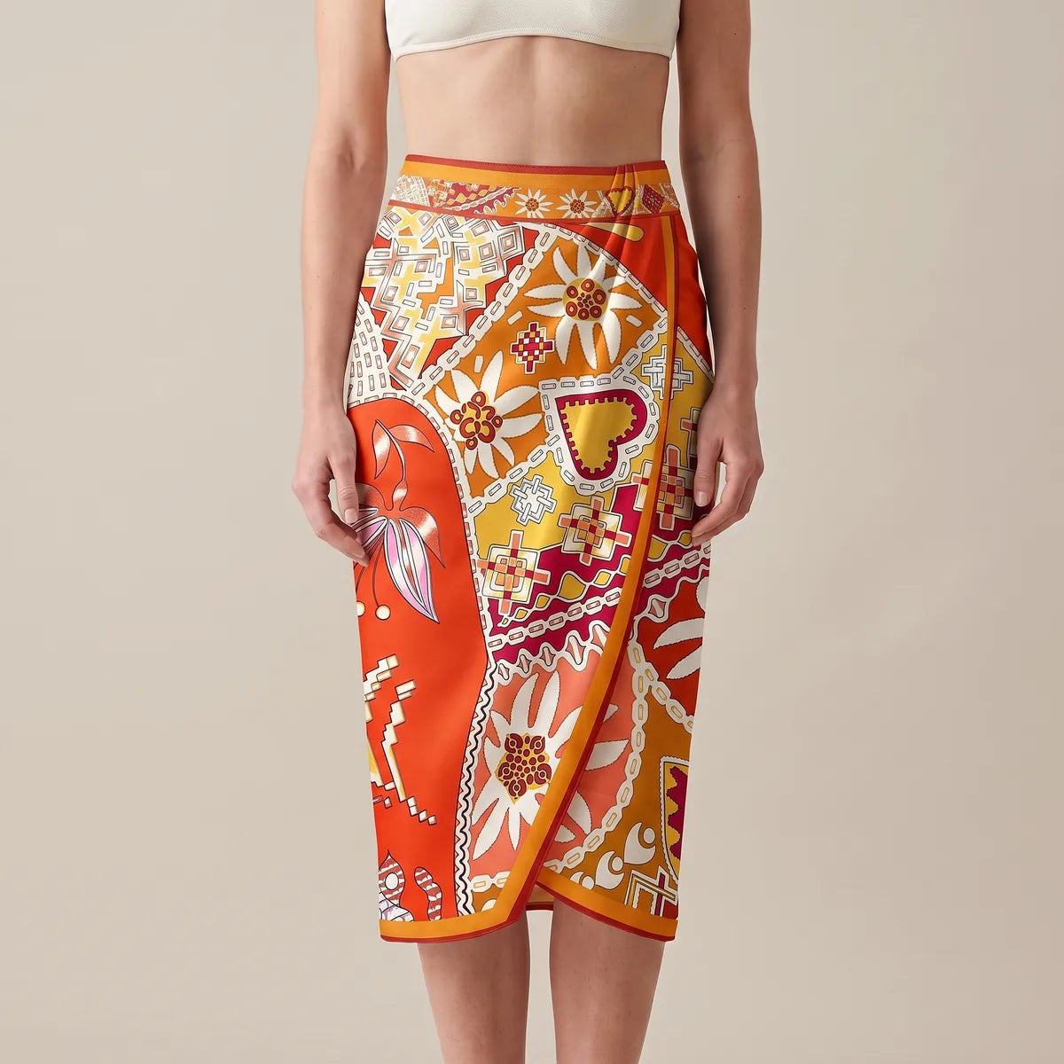Orange folk print silk shawl wrapped at the waist as a sarong, the patchwork and saffron edge running down the front