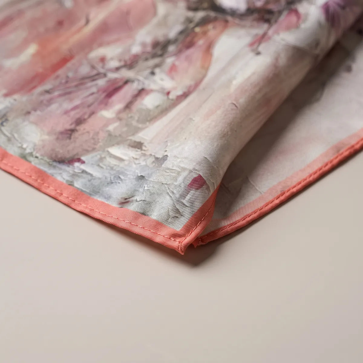 Corner of the pink lily bandana: gray and rose brushstrokes, coral edge and the lighter reverse turned up