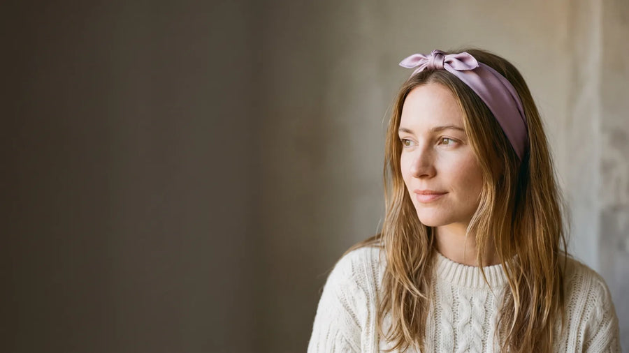 Woman wearing a lilac silk bandana as a knotted headband