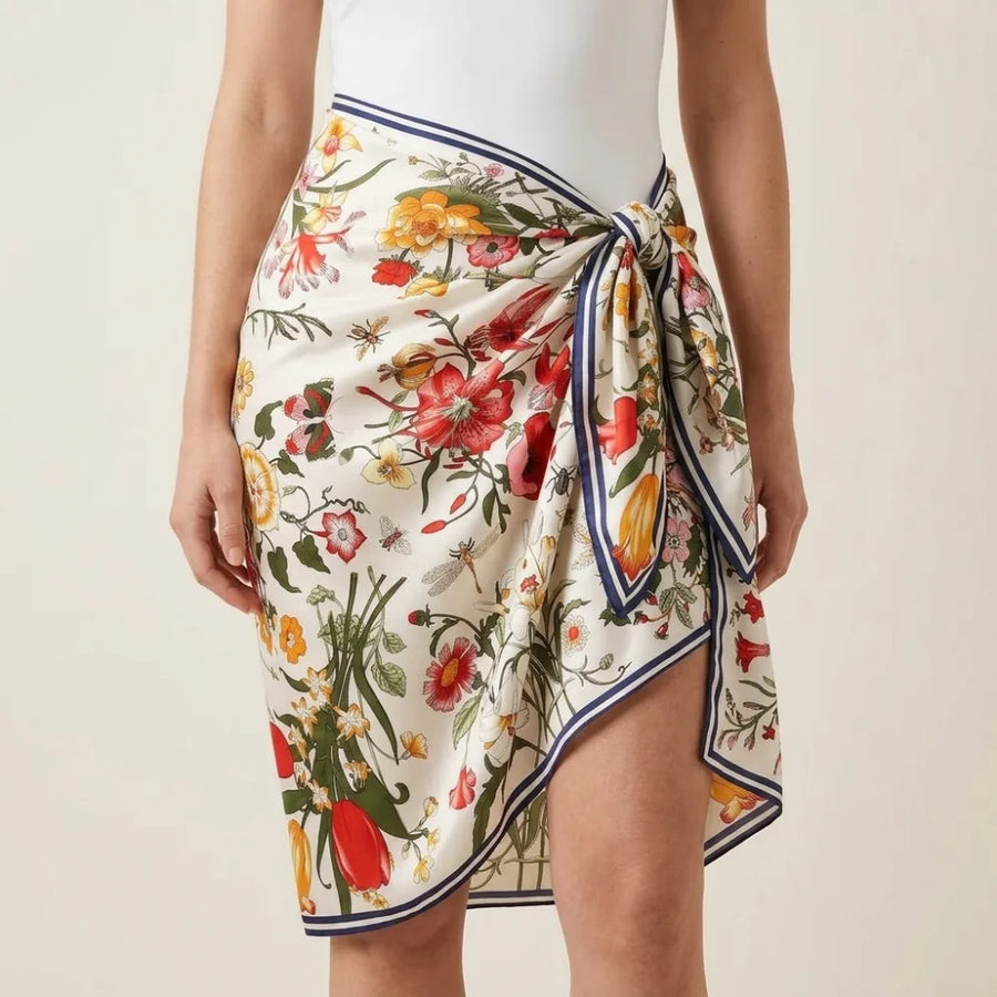 Botanical print silk shawl wrapped round the hips as a beach cover-up