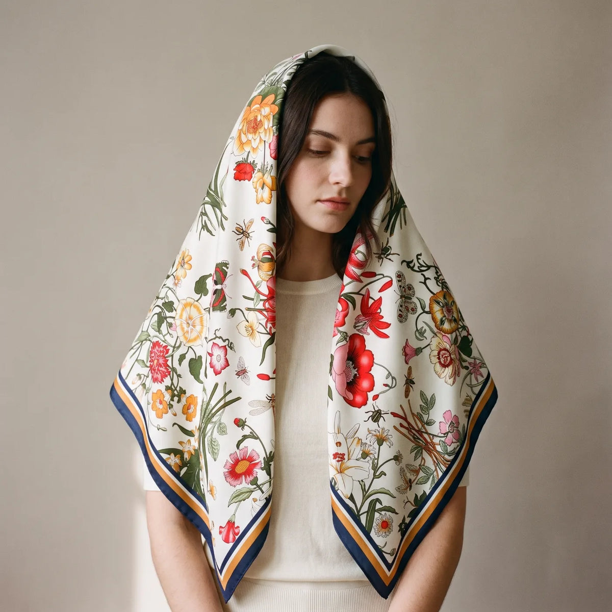 Cream botanical floral silk shawl worn over the head and shoulders
